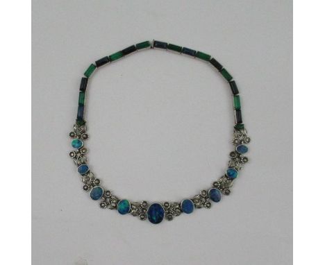 Sibyl Dunlop, A silver black opal doublet necklace, of rectangular cabochon links joined to a flower section cast daisies and