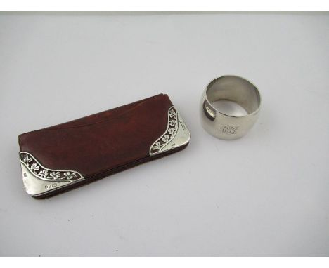 A Victorian/Edwardian red leather and silver mounted purse, Birmingham 1900, together with a silver napkin ring, engraved wit