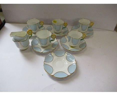 An Aynsley part coffee set comprising five cups, 6 saucers and a cream jug af - The jug has some crazing- 3 of the 5 cups are