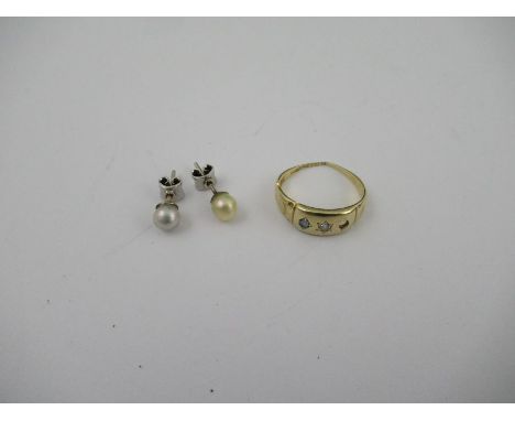 A 15ct gold ring, gypsy set with sapphire and diamond (one sapphire missing), together with a pair of cultured pearl stud ear