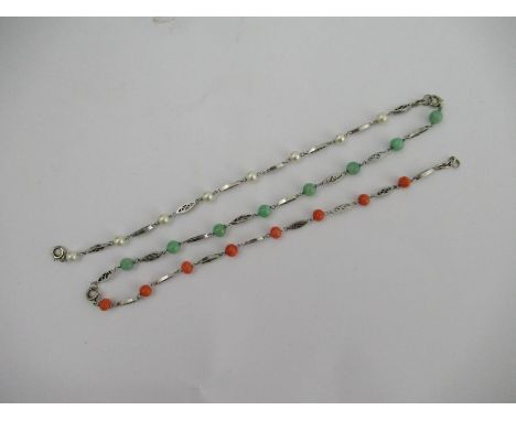 Three 9ct white gold and stone set bracelets, set with coral, pearl and jade with pierced links between, linking together to 