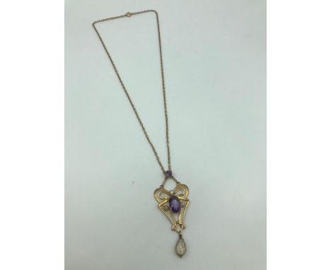 A Lovely example of an Art Nouveau 9ct gold pendant with attached 9ct gold chain. Pendant is made up of Pearls and Amethyst s