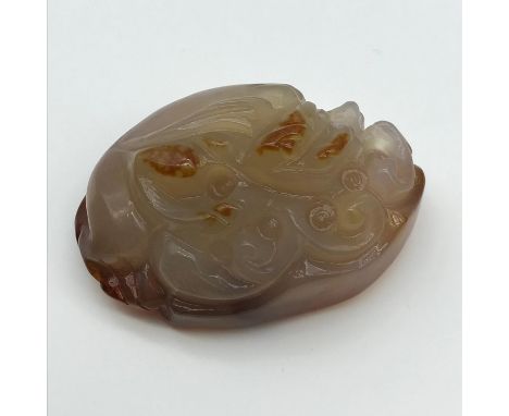 A Chinese hand carved Agate Jade sculpture of a foo dog [6.8cm in length] 