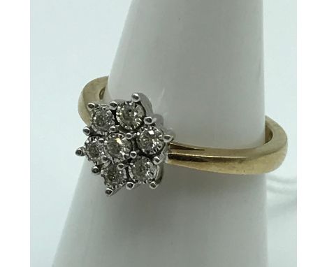 A London 9ct gold ladies 7 diamond ring [0.21ct of diamonds] [Ring size L] [weighs 3.2 grams] 