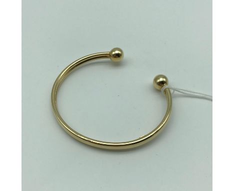 A 9ct gold bangle. Weighs 3.7grams 