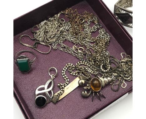 A Collection of silver jewellery which includes 1944 Irag silver filigree bracelet, silver and amber lobster brooch and vario