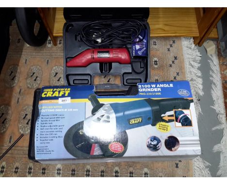 A large 2100 watt angle grinder with an electric stripping tool. 