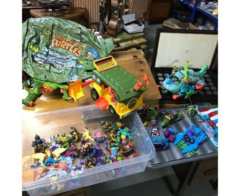 A Collection of 1990's vintage Teenage Mutant Ninja Turtle Figures and vehicles to include Turtle Blimp, Krang, Splinter, Shr