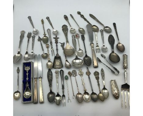 A Large collection of silver, 800 grade, white metal and E.P Spoons and cutlery wares. Includes 900 grade dutch clog souvenir