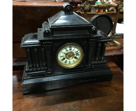 A German made Victorian mantle clock, with ebonised wood case, brass clock front and Roman numerals. 14 day strike, made by H