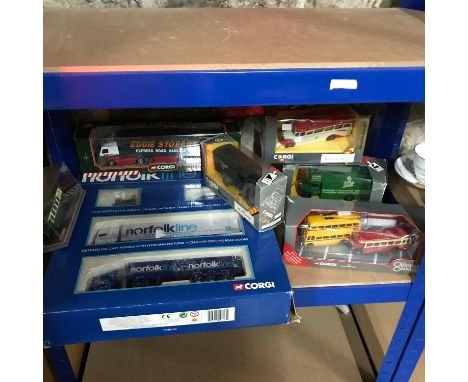 A shelf of Corgi boxed models which includes Eddie Stobart, Buses and various delivery trucks. Also includes Norfolk Line hau