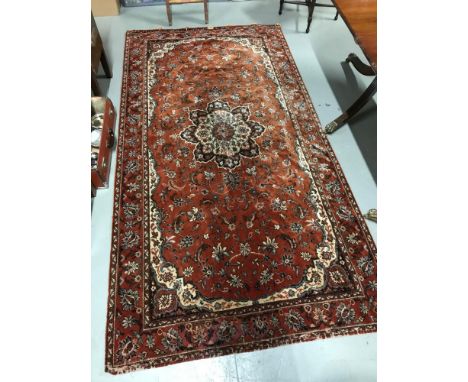 Antique Persian ornate rug together with floral design tapestry rug. Persian rug measures 134x259cm 