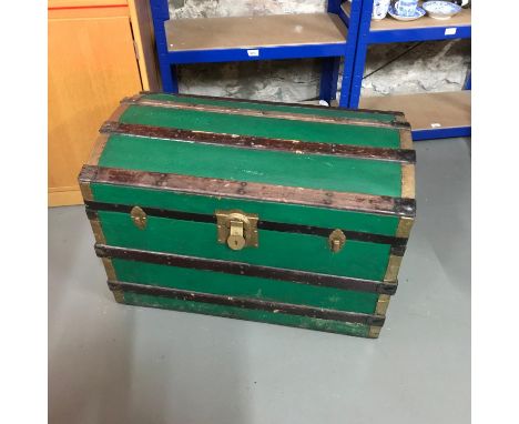 Antique Saratoga trunk with fitted interior drawer. Designed with wood and brass bounds. 