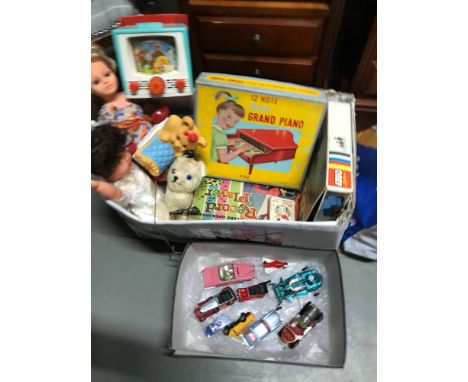 A Collection of vintage toys which includes 12 note grand piano, Lego, Record Player, Corgi models and various dolls. 