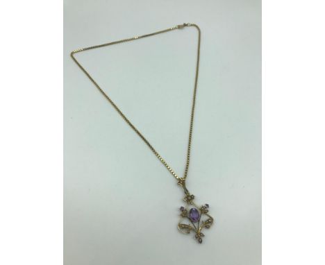 A Lovely example of a 9ct gold Art Nouveau pendant with a 9ct gold chain, The pendant is made up of seed pearls and Amethyst 