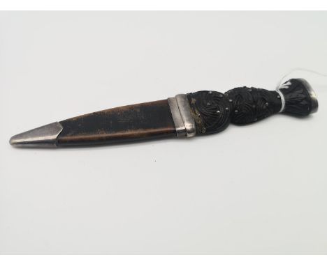 A Glasgow silver mounted sgian dubh. Handle is made with a silver top and Celtic design carved wood, The sheath is made from 
