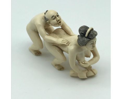 Antique Japanese Meiji period ivory highly detailed erotic couple figure netsuke. Signature to the base of the women's foot. 