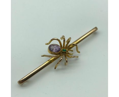 Antique 9ct gold spider bar brooch, detailed with a large amethyst gem stone and an emerald cushion cut stone [total weight 8