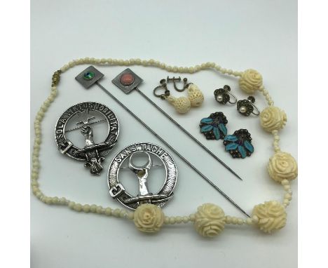 A Lot of vintage and collectable jewellery which includes two ruskin style hat pins, 900 grade silver and enamel clip on earr