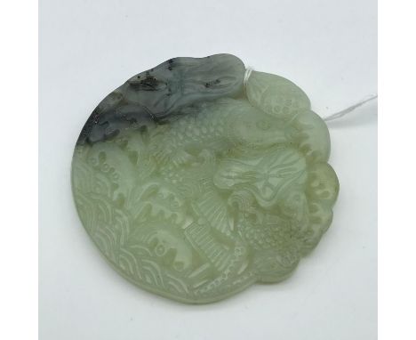 A Large Chinese hand carved jade sculpture of Two Koi Carp. Measures 7cm in diameter 