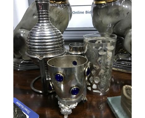 A Sterling silver overlay drinking glass, ornate gem stone and plated drinking cup and plated wine decanter and cup. 