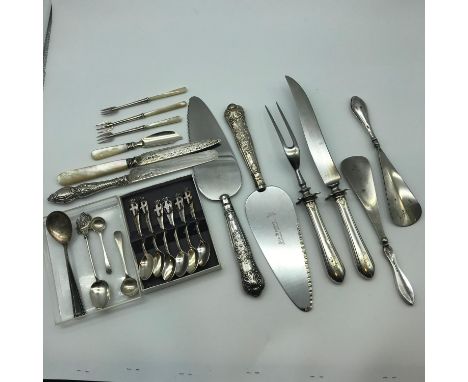 A Collection of silver handled and mother of pearl and silver cutlery. Includes 5 solid silver cutlery items, 5 Silver and mo