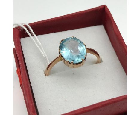 A 9ct gold ladies ring set with a large Aqua marine style stone, ring size Q [Total weight 2.2grams] [stone size: 10mm x 8mm 