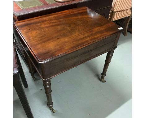 A Victorian Mahogany console wash stand table. Has a  lift up top showing wash stand interior. Designed with turned leg suppo