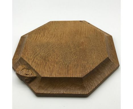 A Very nice example of a Robert "Mouseman" Thompson octagonal cheese board/ tea pot stand. Measures 2x19x19cm 