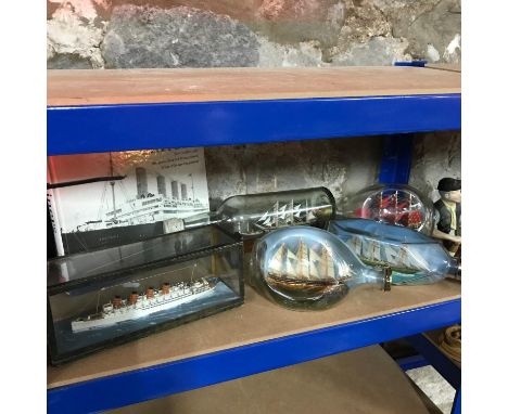 A shelf of collectable Antique ship/ galleon models in bottles and display case. Comes with Liners book. 