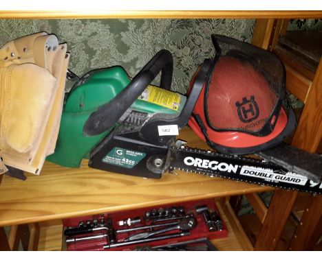 An untested gardenline chainsaw with helmet and tool belt 