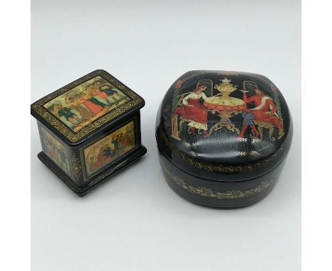 Two Highly detailed Russian hand painted lacquered trinket boxes. Both have figures and signed by the artists, Also dated 199