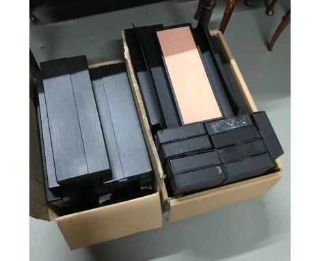 2 boxes filled with large ring boxes 