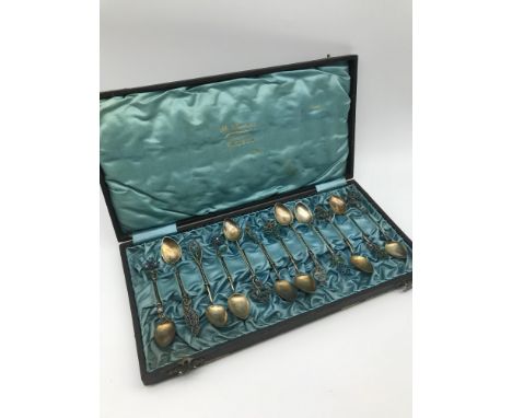 A Lot of 12 Sterling silver 900 grade and enamel tea spoons made by Marius Hammer, Comes with original box. 
