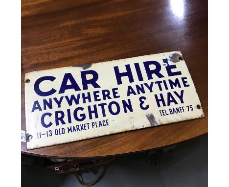 An original Motoring enamel sign. 'Car Hire anywhere anytime Crighton &amp; Hay. Measures 17.5x38cm 