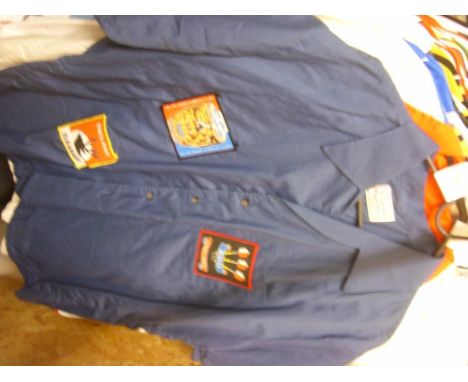 Darts, Eric Bristow, an original players match worn blue cotton, shirt, as worn by Eric.  The front has 2 cloth badges, BDO E