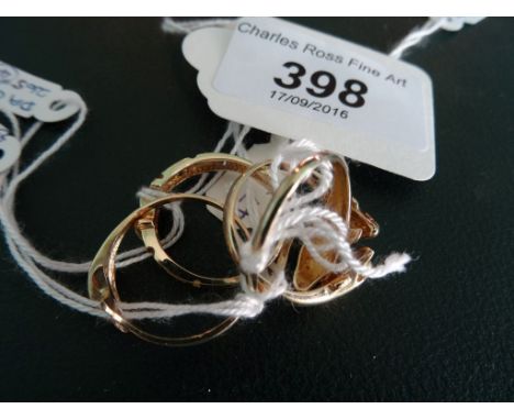 A diamond set dolphin ring, two further dolphin rings and one other ring.
