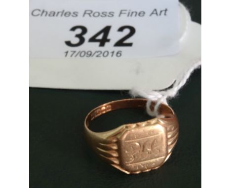 A gentleman's 18 carat gold signet ring, with reeded shoulders and monogram to centre.