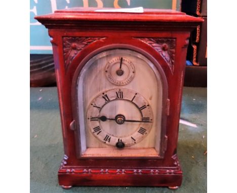 A 20th century H. Williamson Limited mantle clock, no. 19651, the silvered dial bearing Roman numerals on four bun supports, 