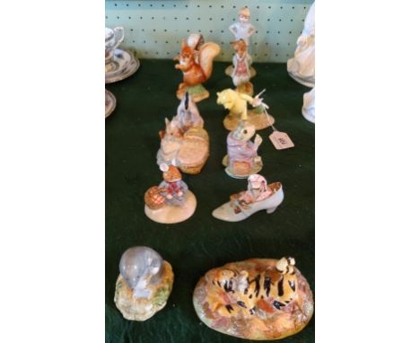 A collection of ornamental ceramic figurines, to include: Royal Doulton Winnie the Pooh collection figures, Royal Albert Beat