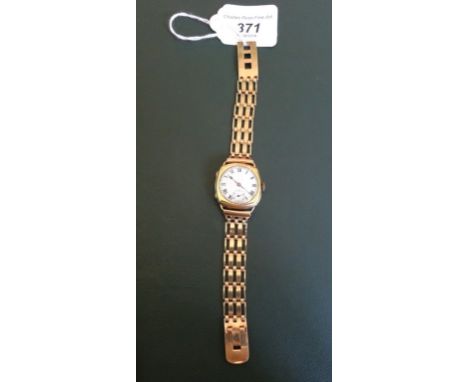 A gentleman's 18 carat yellow gold Peerless watch, the hinged cushion shaped case enclosing a white metal Roman dial with ins