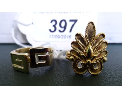 An 18 carat gold ring with openwork Greek Key decoration, together with another classical style ring marked 750. Condition Re