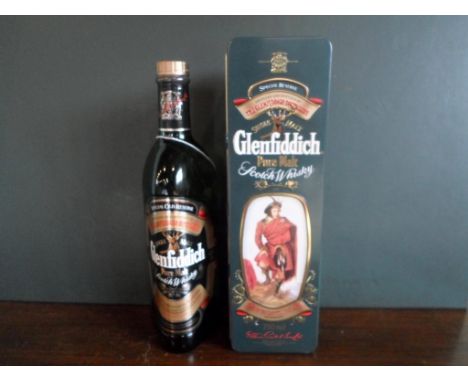 A bottle of Glenfiddich Special Old Reserve Pure Malt Scotch Whisky in a Clans of the Scottish Highlands Drummond tin, bottle