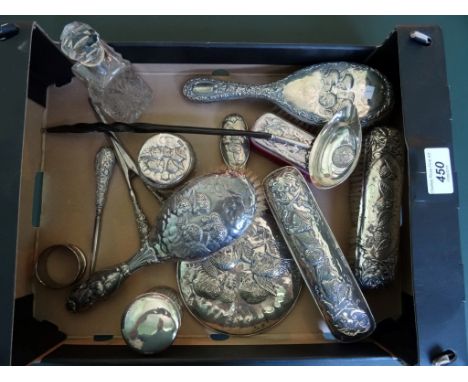 A silver backed dressing table set, comprising: two hair brushes, a hand mirror and two clothes brushes, together with a todd