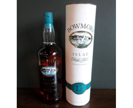 A bottle of Bowmore Islay Single Malt Scotch Whisky, aged 12 years, in original tube, bottled in the 1990s, 1L, 43% vol.