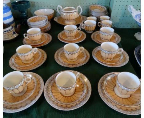 An Edwardian china part-tea service, having peach and gilt finished decoration, comprising: trios, twin handled open bowl, ca