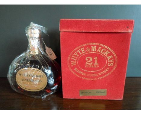 A bottle of Whyte & Mackay Blended Scotch Whisky, 21 years old, in original box, 26 2/3rds  fl oz, (70% proof), bottled in th