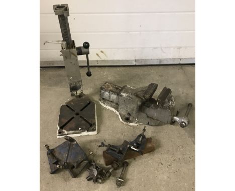 A collection of vintage tools to include drill stand, vice and corner clamps.  