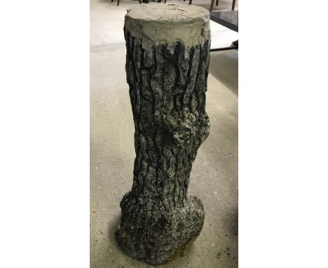 A concrete garden pedestal in the shape of a tree trunk.  Approx. 72cm tall.