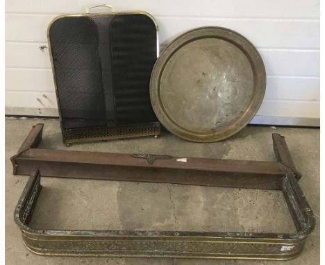 A small collection of large brass items. To include fire fenders, folding fire screen and circular tray. 